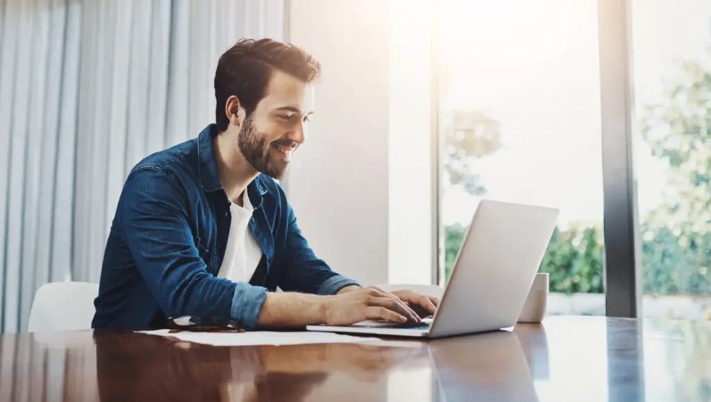 man sitting and working with clear cut consultants on a go to market strategy